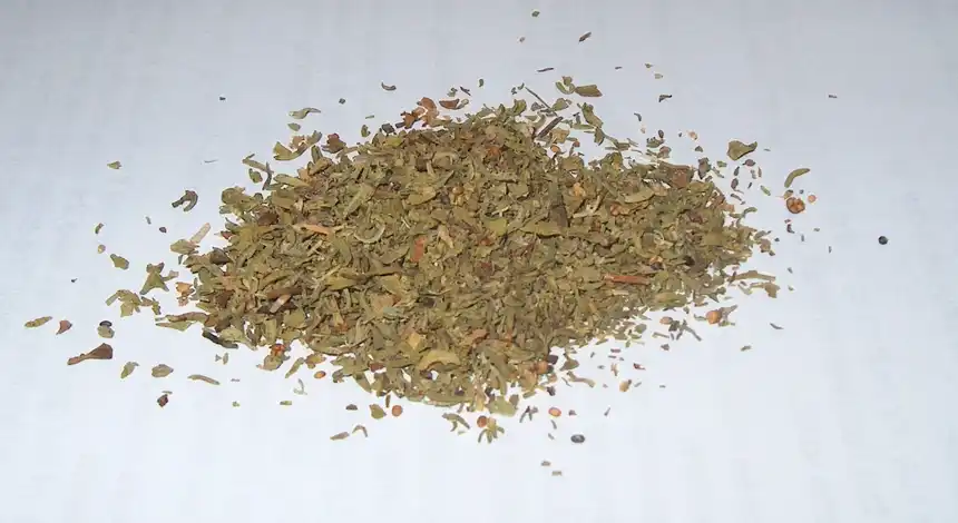 Pile of dried savory herb used as a cooking spice
